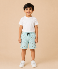 Child wearing a white t-shirt and light blue shorts with a pattern on a beige background