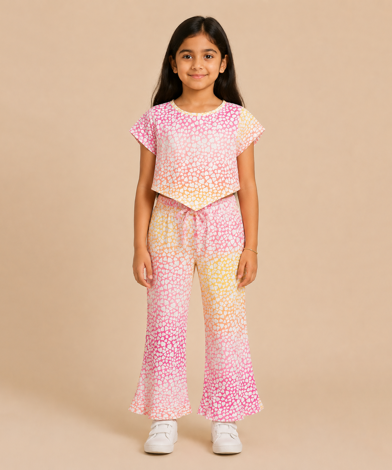 Young girl wearing a colorful outfit with a gradient pattern on a beige background